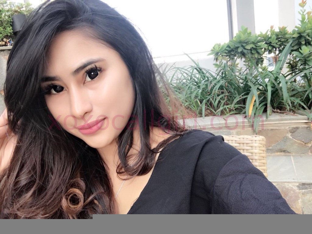 KL Escort Girl Yasira, a beautiful Malay Escort in Kuala Lumpur, poses outdoors. Malaysia Sex Service