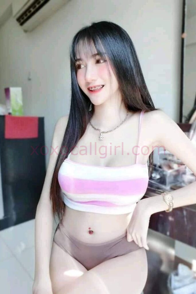 KL Escort Girl Woman holding a sign that reads "Malay Escort.site" on a black background. Malaysia Sex Service