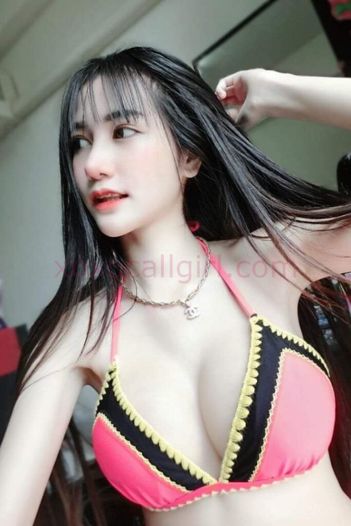 KL Escort Girl Woman holding a sign that reads "Malay Escort.site" on a black background. Malaysia Sex Service