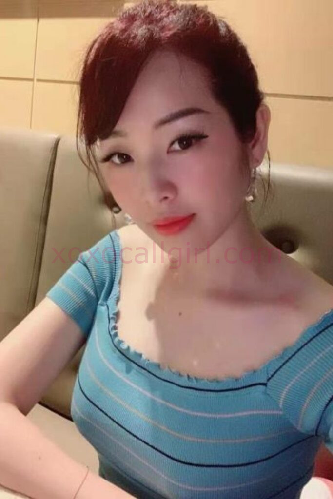 KL Escort Girl Chinese Escort ad with woman holding a sign reading "Chinese Escort.site Malaysia Sex Service