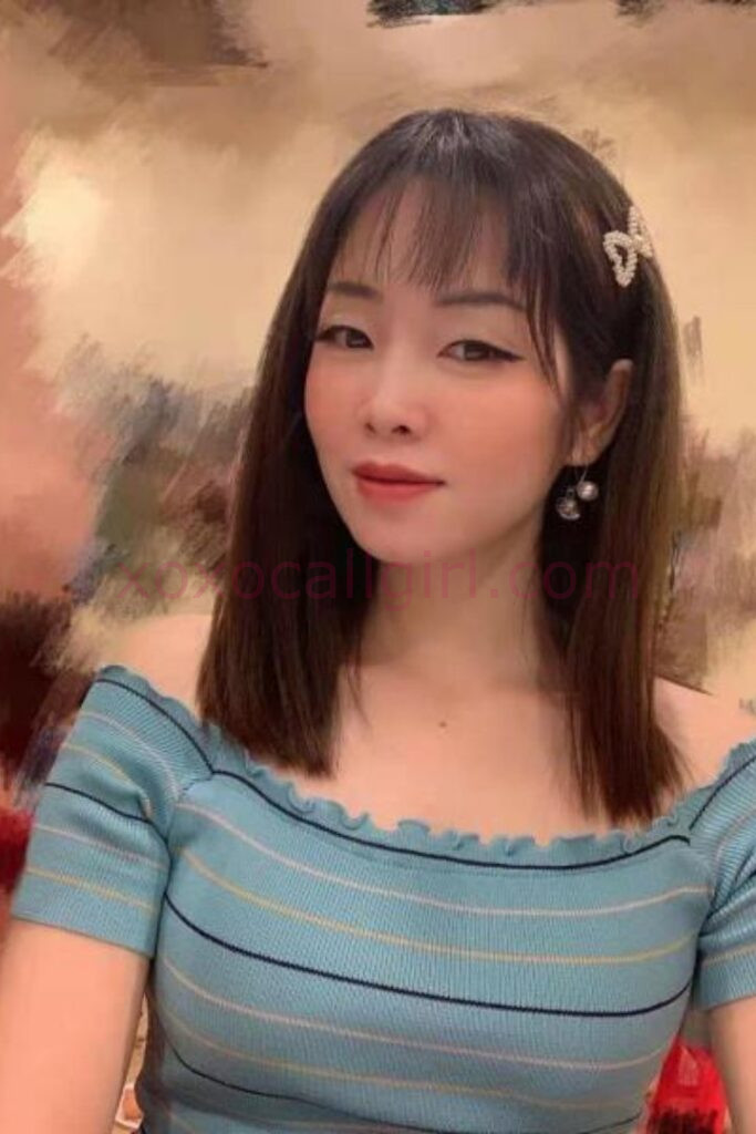 KL Escort Girl Chinese Escort ad with woman holding a sign reading "Chinese Escort.site Malaysia Sex Service