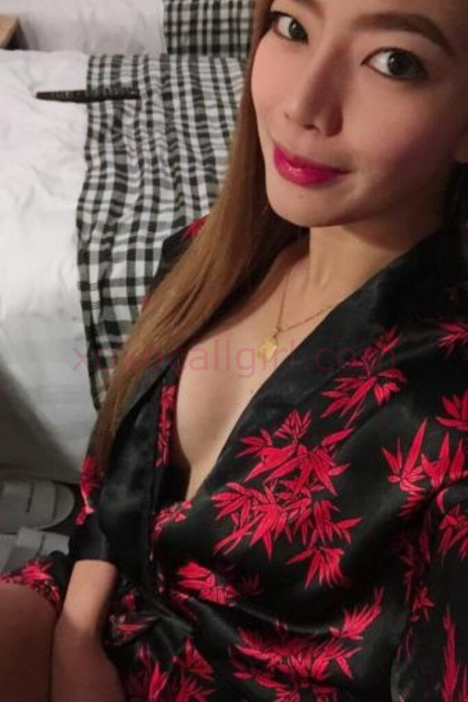 KL Escort Girl Elaiza, a local Chinese escort in Kuala Lumpur, wearing a red and black robe. Malaysia Sex Service