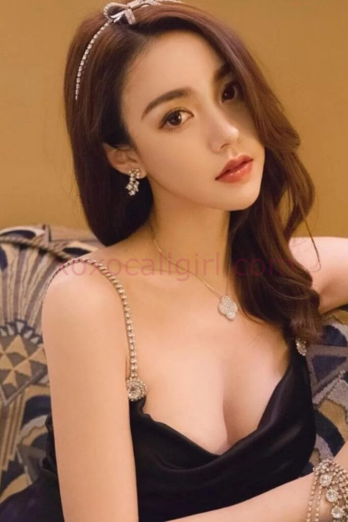 KL Escort Girl Elegant Chinese Escort Sheila in Kuala Lumpur, wearing a black dress and jewelry. Malaysia Sex Service