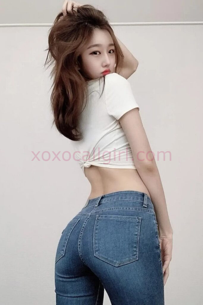 KL Escort Girl Sheila, a Chinese Escort, poses in jeans and a white top. Incall Escort Kuala Lumpur. Malaysia Sex Service