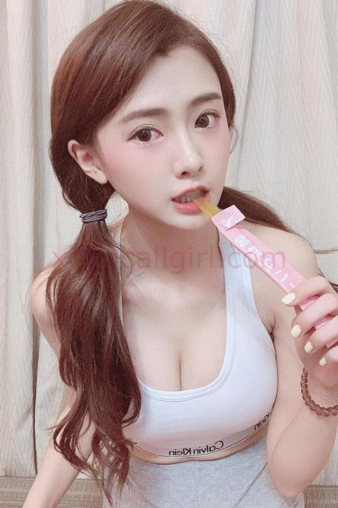 KL Escort Girl Valerie, a local Chinese escort, poses holding a pink package. Sex escort in Kuala Lumpur. Malaysia Sex Service