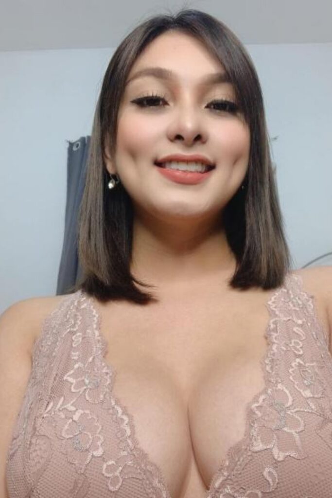 KL Escort Girl Smiling woman with dimples and a lace top. Malaysia Sex Service