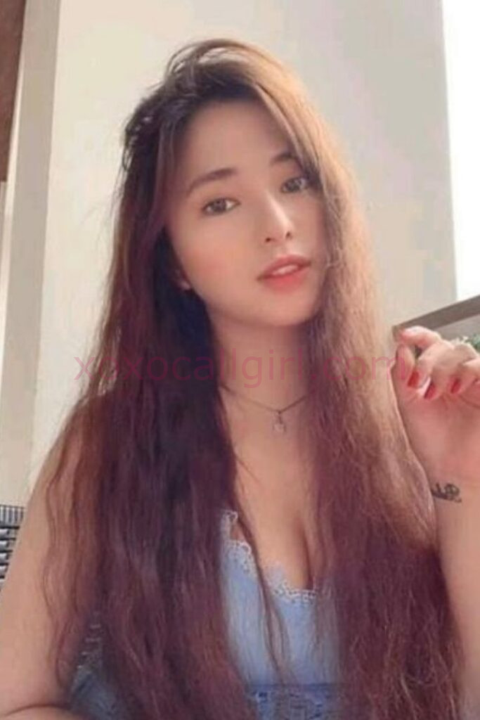 KL Escort Girl Malay Escort Girl Umaira in Kuala Lumpur, smiling with long brown hair and a necklace Malaysia Sex Service
