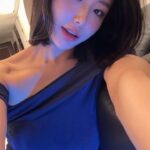 KL Escort Girl Stylish Asian woman with a bob haircut in a blue one-shoulder top. Malaysia Sex Service