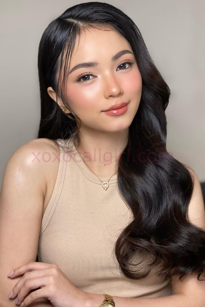 KL Escort Girl Beautiful Malay Escort in Kuala Lumpur with elegant waves and a neutral top. Malaysia Sex Service